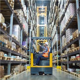 Forklift driver uses the PowerScan 9600 in warehouse.