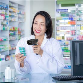 Woman uses barcode scanner to check medicine