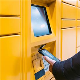 Self-service parcel collection point, using Newland micro kiosk and barcode scanner.