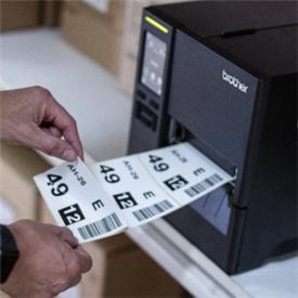 Warehouse label being printed on Brother label machine.
